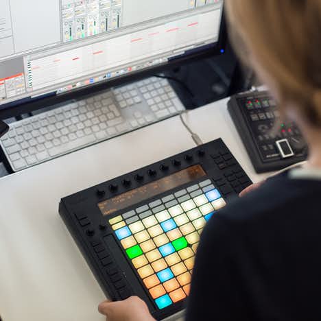 woman working with music mixer from Ableton